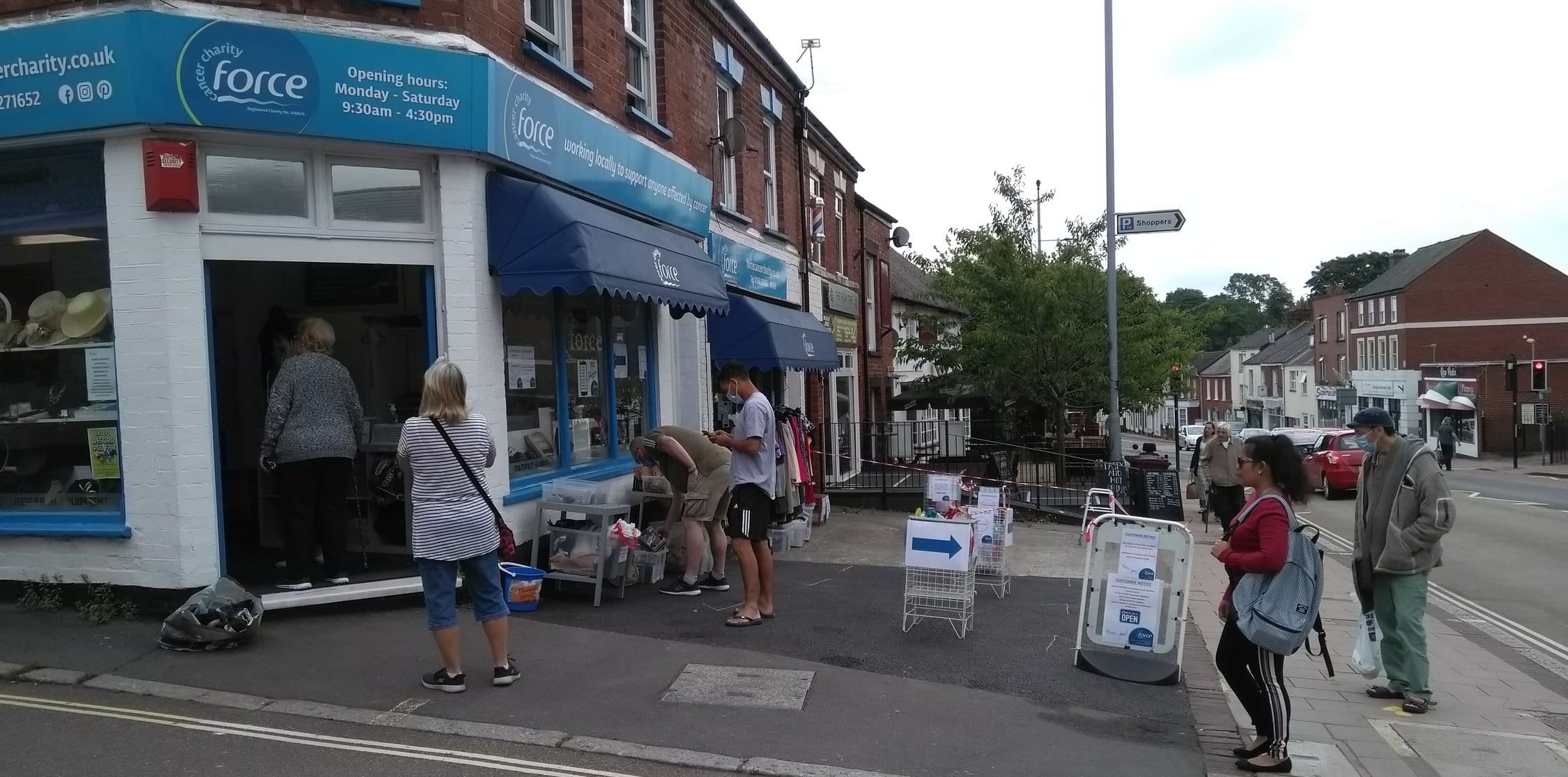 Queues outside the shop as it reopens