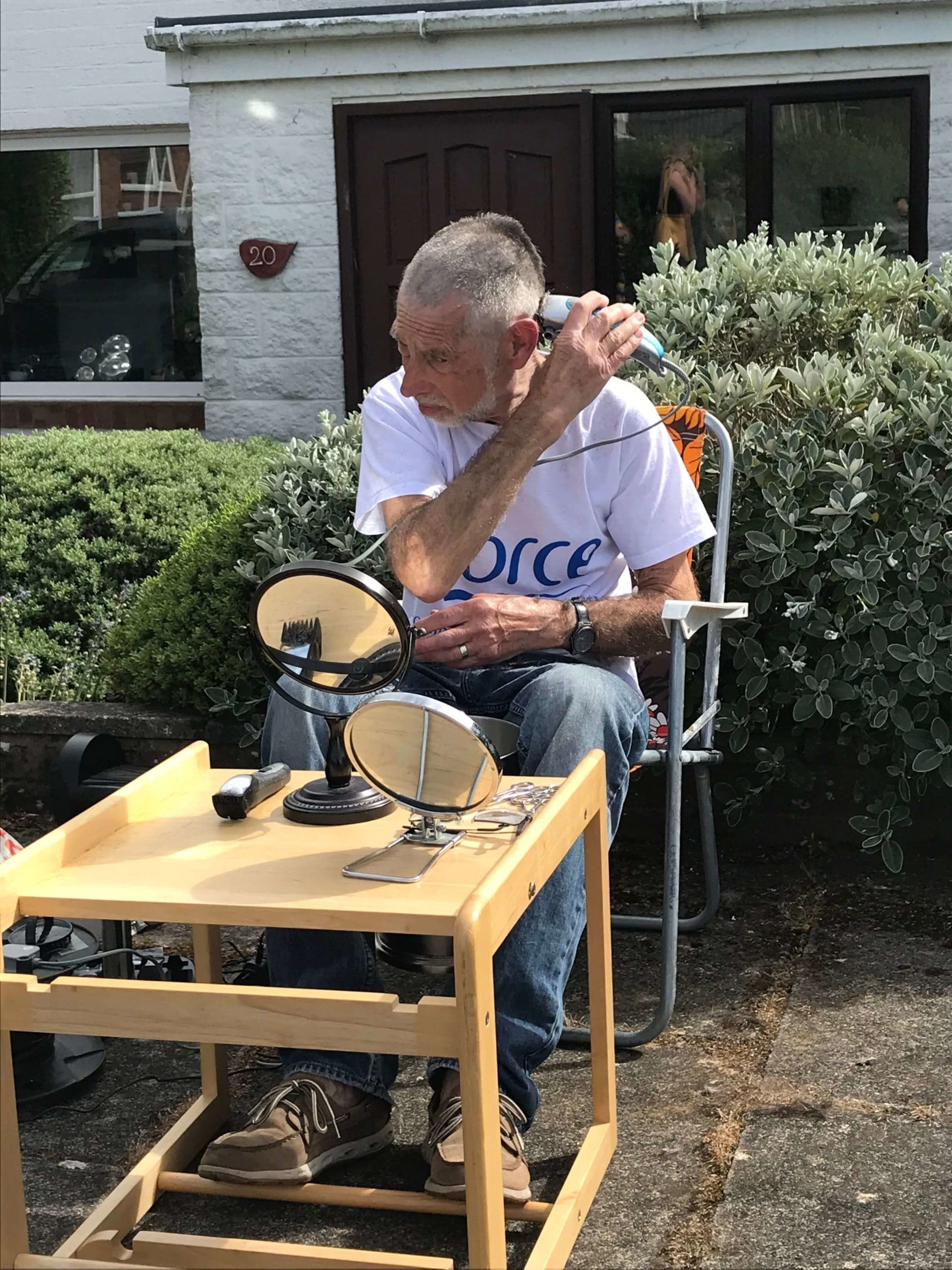 John Williams shaving his head