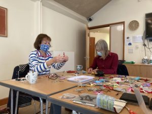 Jane Martin and Lesley Hunter making decorations for FORCE