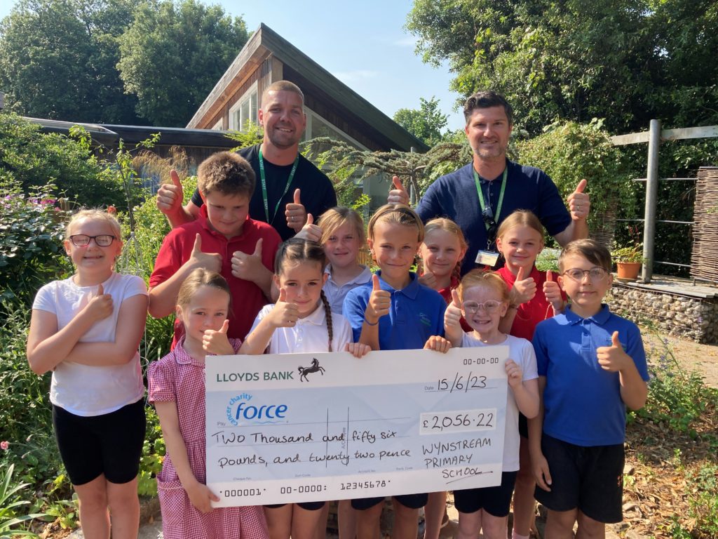 Wynstream School children present a cheque to FORCE Cancer Charity