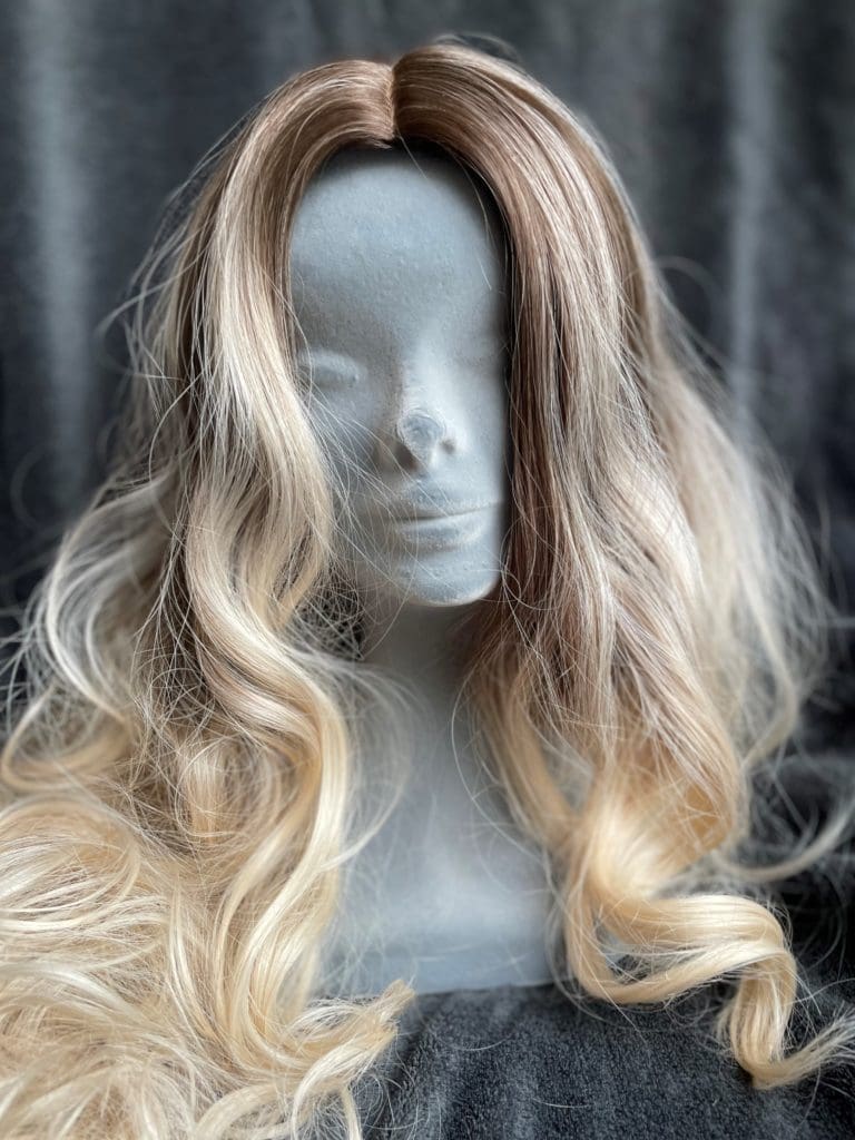 Blonde with dark roots and a basic cap 159