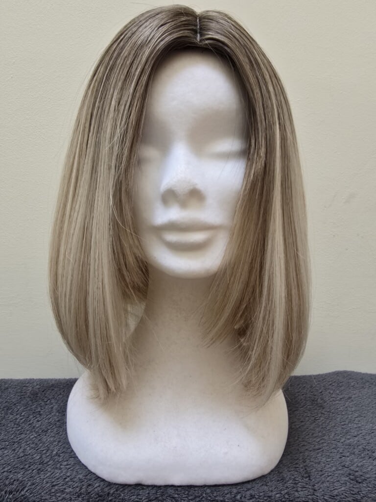 Blonde with a Basic Cap and Monofilament Top Wig No. 555