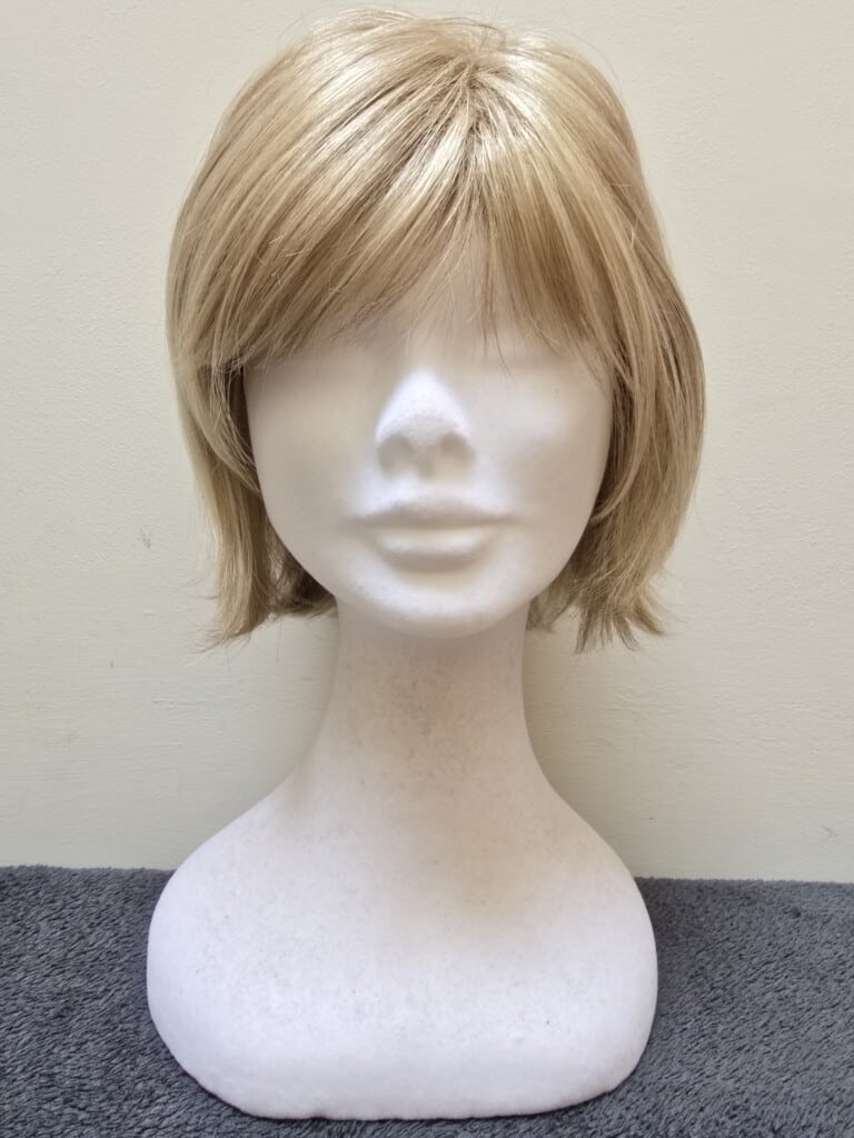 Blonde with a Basic Cap and Monofilament Parting Wig No. 556