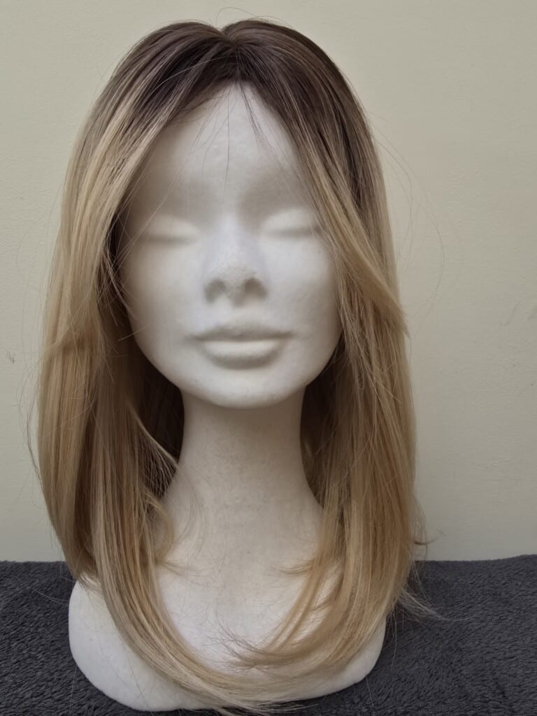 Blonde with a Basic Cap and Monofilament Parting Wig No. 557