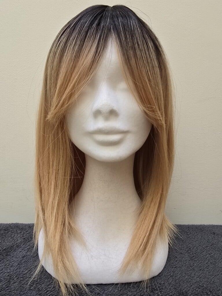 Blonde with a Basic Cap and Monofilament Top Wig No. 558