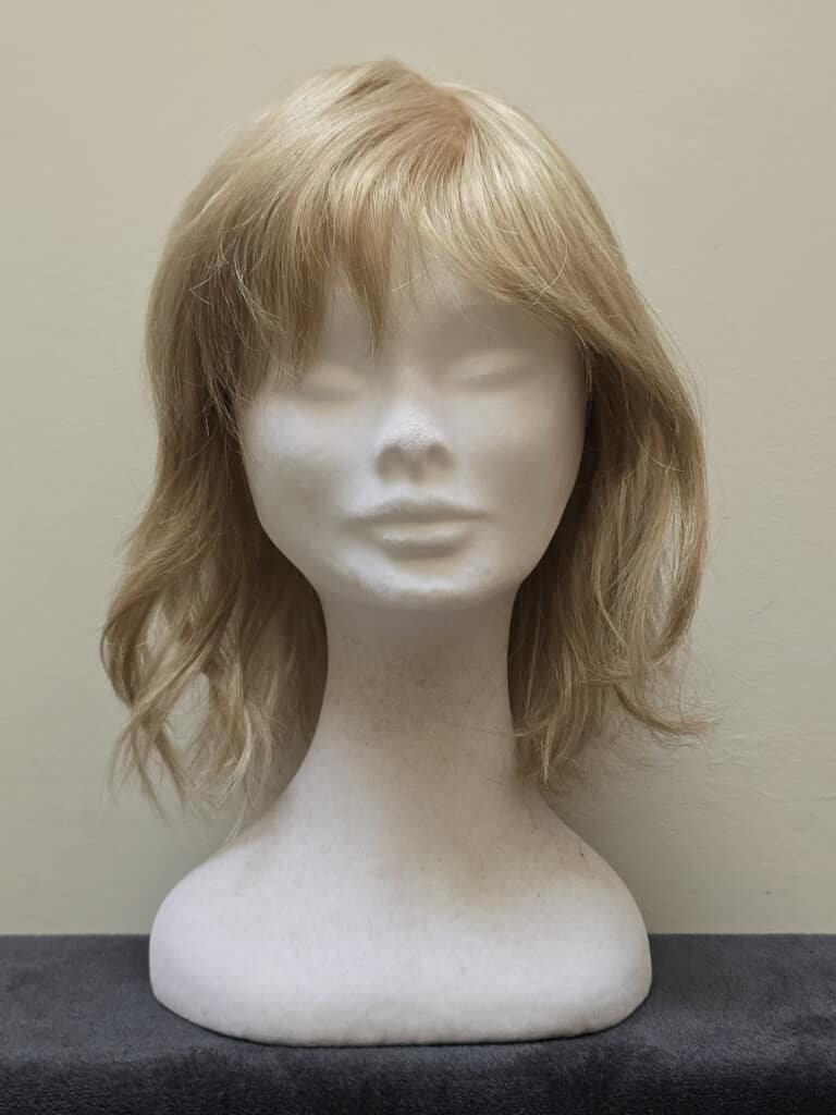 Blonde with a Basic Cap and Monofilament Top Wig No. 611